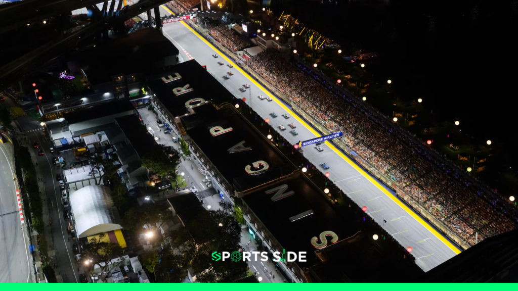 A bird eye view of Marina Bay circuit in Singapore at night. Cars lined up for the session.