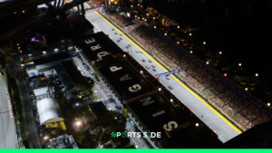 A bird eye view of Marina Bay circuit in Singapore at night. Cars lined up for the session.